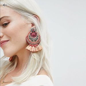 Orange statement earrings with tassels